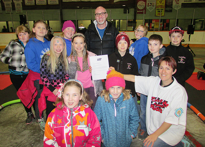 Grade 5 students at Good Shepherd Catholic School in Wallaceburg took part in the Racing Against Drugs awareness campaign in Chatham on Friday and one lucky student will be the winner of a new bike from Canadian Tire. Chairperson Amanda Wyatt presented the class with the certificate.