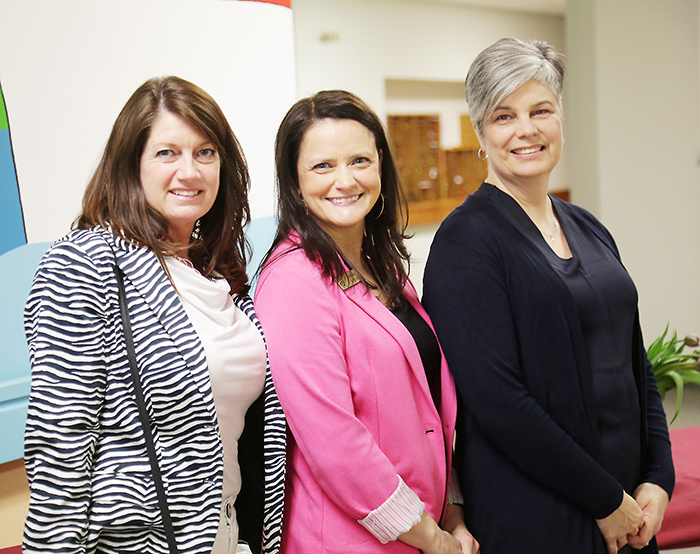 From left, Darlene Smith, Andrea Sullivan and Tania Sharpe are just three of 84 women who attended the recent Purses with a Purpose fundraiser.