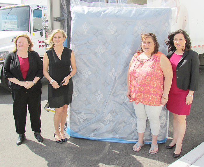 Sleep Country Canada, recently opened in north Chatham, donated beds and bedding to nine local families on April 27 as part of its community outreach mandate. From left are Shelley Wilkins, Chatham-Kent Director of Housing Services; Christine Magee, Sleep Country co-founder and executive co-chair; donation recipient Teresa Coleman; and Lynn Martel, Sleep Country vice-president of community programs.