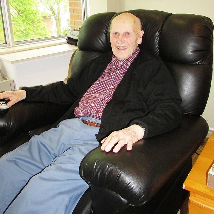 Ken Thompson relaxes in his room at St. Andrew’s Residence. The avid shutterbug and retired farmer enjoys his time there, and never goes anywhere without his camera.