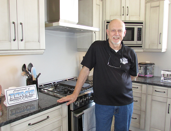 John Deryck of Leeds Cabinet showcases the custom, hand-crafted cabinet detail in the new home build on Pioneer Line.