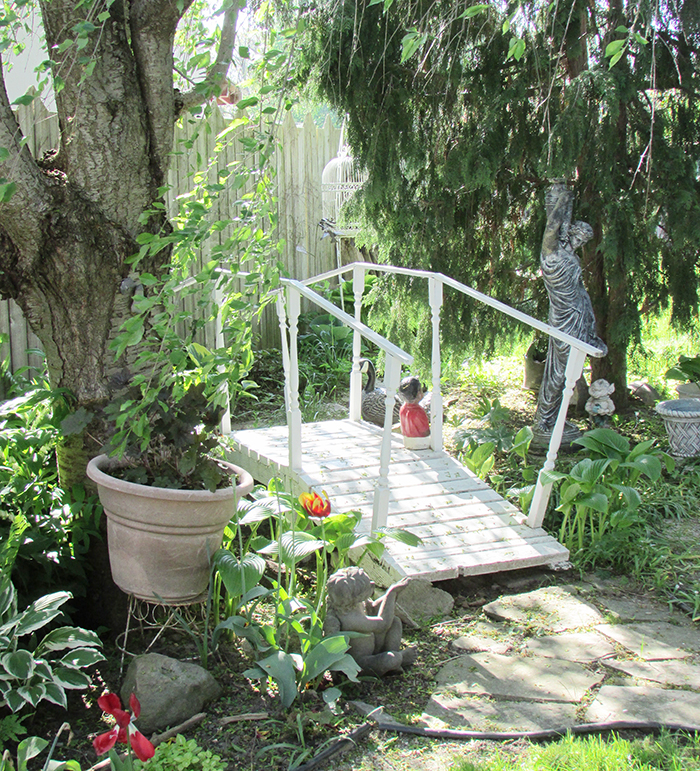 The gardens of Eric and Sherrie Piens in Chatham are part of the Zonta annual garden and pond tour, set for June 23 and 24. Pictured are the front and back gardens, before the annuals are even planted. Piens promises even more colour for the event.