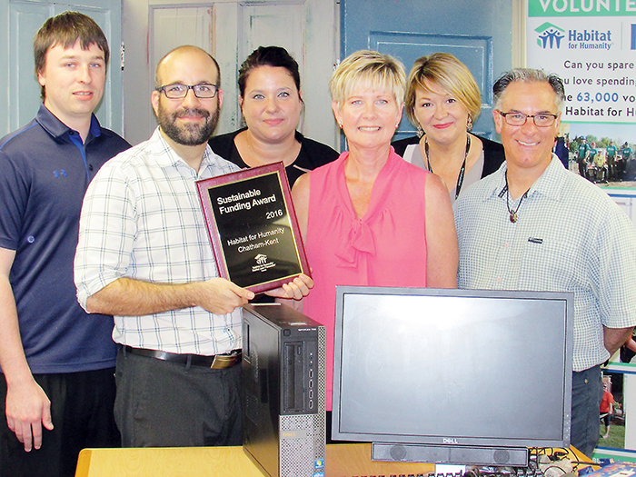 Representatives of the local Habitat for Humanity and the Municipality of Chatham-Kent celebrated a national award received as the result of a joint project to reuse computers. Left to right are Jordan Labonte (HFHC-K IT committee volunteer), Richard Drouillard (HFHC-K IT Chair and Board President), Nancy McDowell (HFHC-K Executive Director), Polly Smith (Program Manager of Employment and Social Services for the municipality), Dave Demers (Learning Co-ordinator with CKESS) and Anne Taylor (HFHC-K Volunteer Co-ordinator).