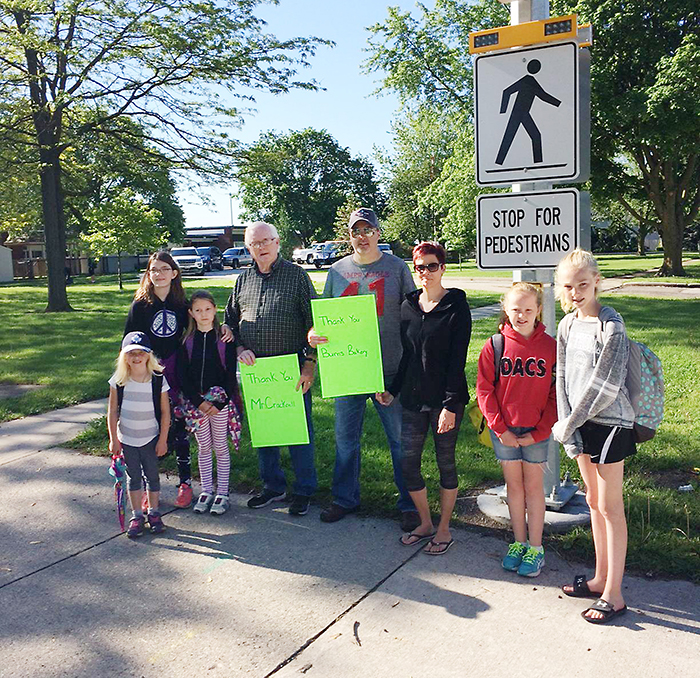 The students at Dresden Area Central School and the community thanked crossing guard Jim Cracknell and the businesses who made sure he was able to stay on the job until the new crosswalks were in place. Pictured are, from left, Addy McLean, Rebecca Pederson, Victoria Pederson, Jim Cracknell, Rob Burnett, Erin Burnett, and students Marissa McGee & Abby McGee.