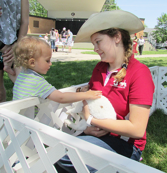 Aldo Machado gets up close to a bunny thanks to Hannah Phillips of TJ Stables during Saturday’s C-K Youth Festival in Tecumseh Park.