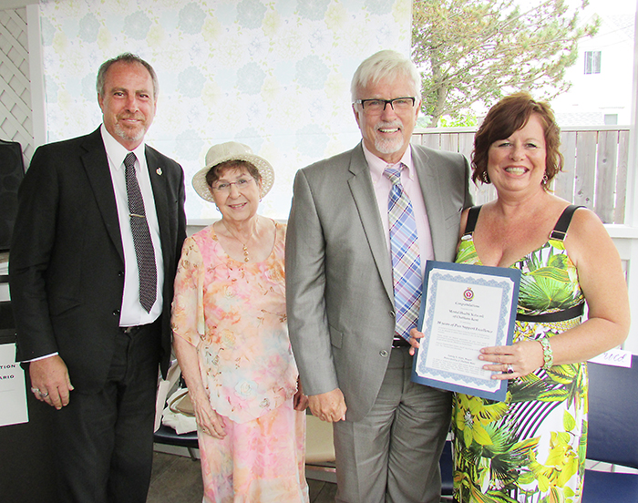 CK Mayor Randy Hope presented a certificate to the Mental Health Network founder Ida Vsetula, centre, and executive director Kelly Gottschling in honour of the 10th anniversary of the organization recently. They were joined by Chatham-Kent Leamington MPP Rick Nicholls.