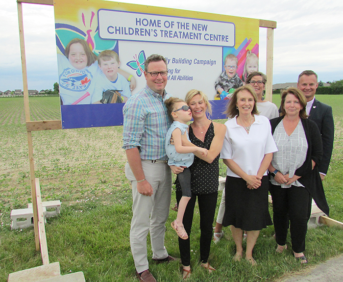 From left, Don and Jackie Lundy with daughter Sydney, 6, Donna Litwin-Makey, Tracy Bultje, Beth Cummings and Mike Grail proudly stand in front of the land the Children’s Treatment Centre of Chatham-Kent Foundation has secured for a new building for the centre.