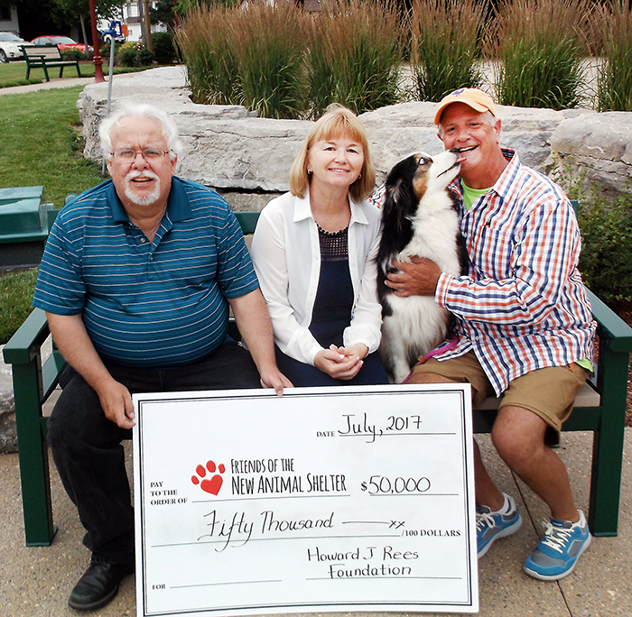 When the Chatham-Kent’s new animal shelter fundraising effort received a $50,000 boost from the Howard J. Rees Foundation this week, one local canine seemed particularly thankful. During the cheque presentation, Hula decided to give her owner Jim Sanson a friendly lick on the cheek. From left, Art Stirling, chair of the Friends of the new Animal Shelter; Foundation representative Anne Fisher; Hula; and Jim Sanson of the foundation.
