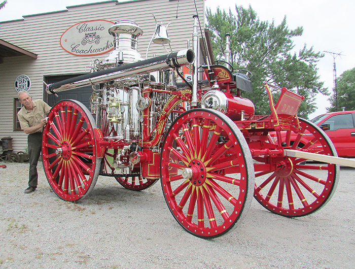 Stan Uher polishes up an 1897 Clapp & Jones steam pump owned by the Dawson City Fire Department. Uher spent 1,400 hours restoring the pump to mint condition in his Blenheim workshop.