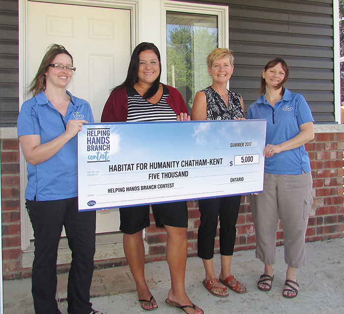 Maddalena Vaughan, left, and Jolene Turner of Libro Credit Union in Blenheim hand a cheque for $5,000 to Habitat for Humanity officials Anne Taylor and Nancy McDowell.