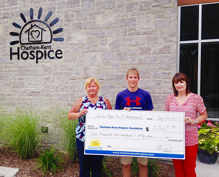 From left, Connie Santavy and Rhys Dulisch present Jodi Maroney, Chatham-Kent Hospice Foundation Executive Director, with the proceeds from this year’s Blenheim Soccer Dogs 3 on 3 Tournament.